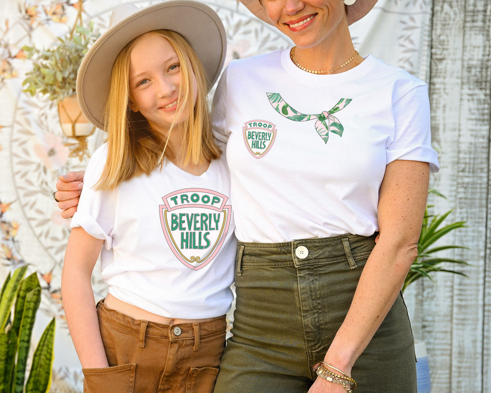 This Troop Beverly Hills scarf tee shirt is for the girl who wishes she could be Phyllis Nefler. You've seen other Troop Beverly Hills shirts, but this is an original, baby - the logo is inspired by the film and iconic Beverly Hills sign, and hand-drawn by Bonnie Bryant O'Connor, with a jaunty, trompe l'oeil, hand-drawn palm print scarf.