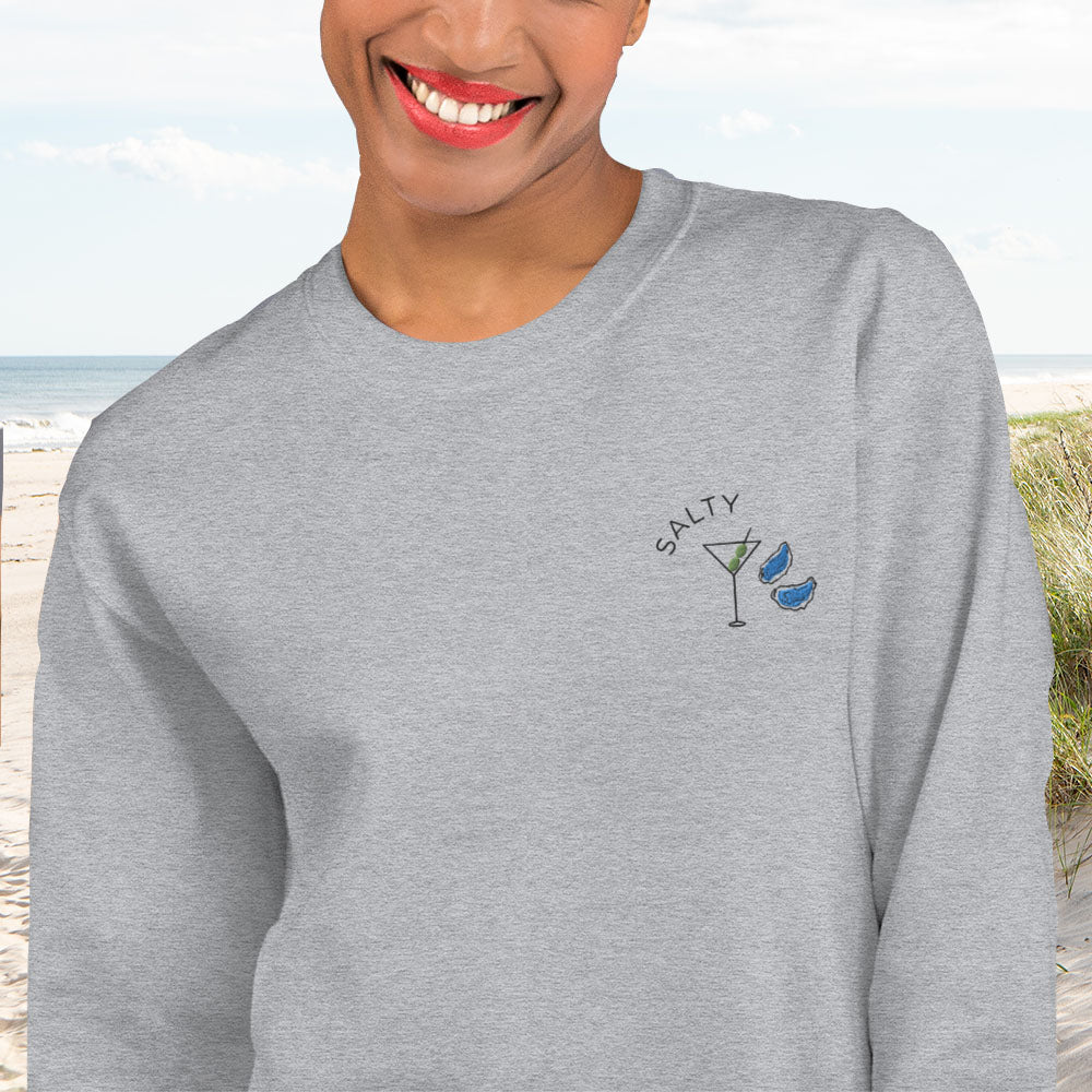 Our Salty sweatshirt is brand new for summer and ready to party. It features an embroidered dirty martini, embroidered oyster, and embroidered "SALTY" on the left chest. Wear it to a bonfire at your summer share in Nantucket or a beach party at Surf Lodge in Montauk. Original copyrighted design by Bonnie Bryant O'Connor.